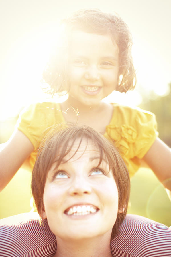 Adult Photograph - Smiling Mother Holding Daughter by Gillham Studios