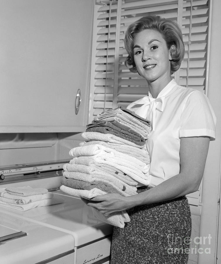 Smiling Woman Holding Folded Laundry Photograph by H. Armstrong Roberts/ClassicStock