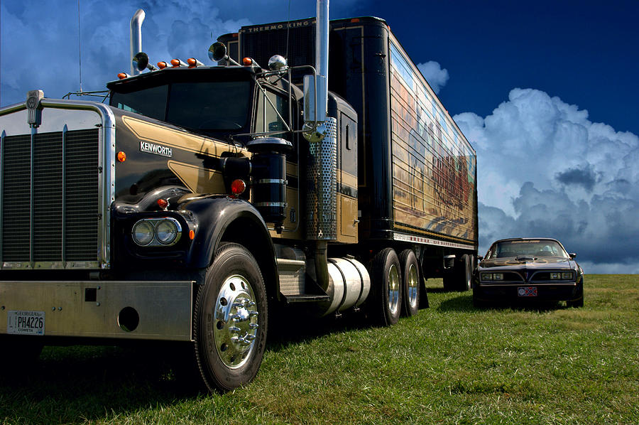 Smokey And The Bandit Photograph - Smokey and the Bandit Tribute 1973 Kenworth W900 Black and Gold Semi Truck and The Bandit TransAm by Tim McCullough