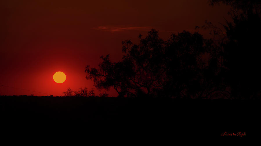 Smokey Sunset Photograph by Karen Slagle