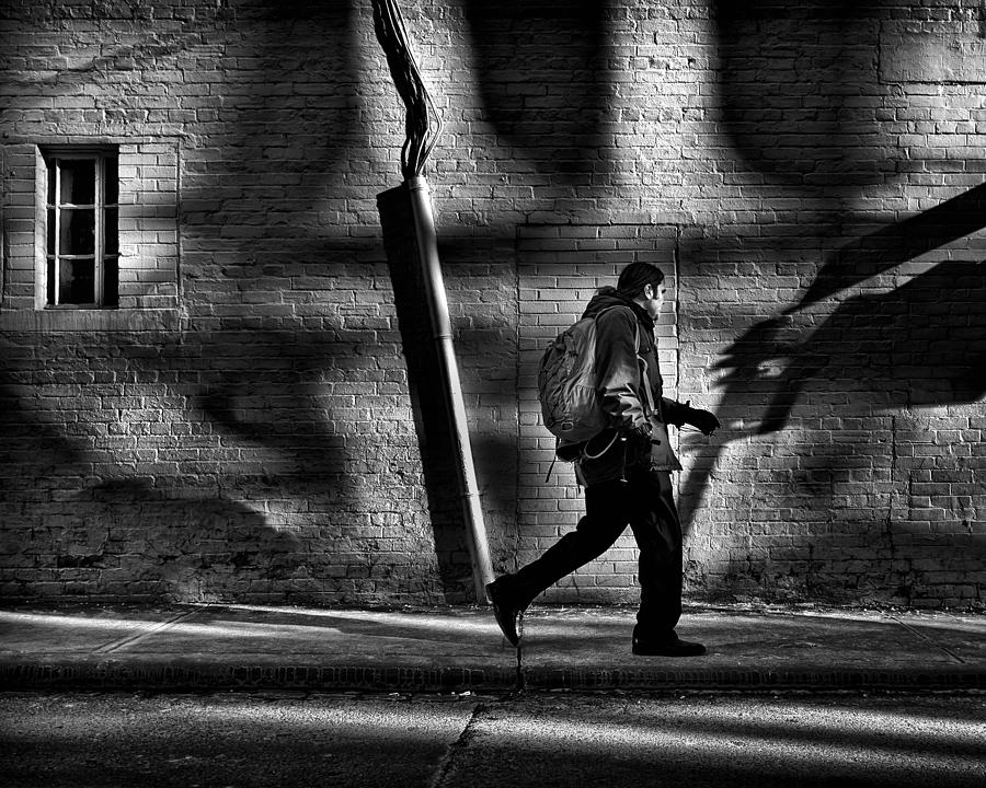 Black And White Photograph - Sneakin Thru The Alley by Brian Carson