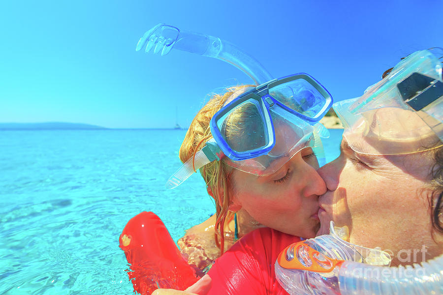 Snorkeler couple honeymoon Photograph by Benny Marty