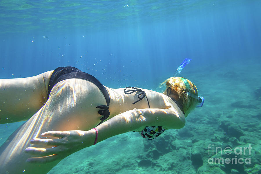 Snorkeler woman swimming Photograph by Benny Marty