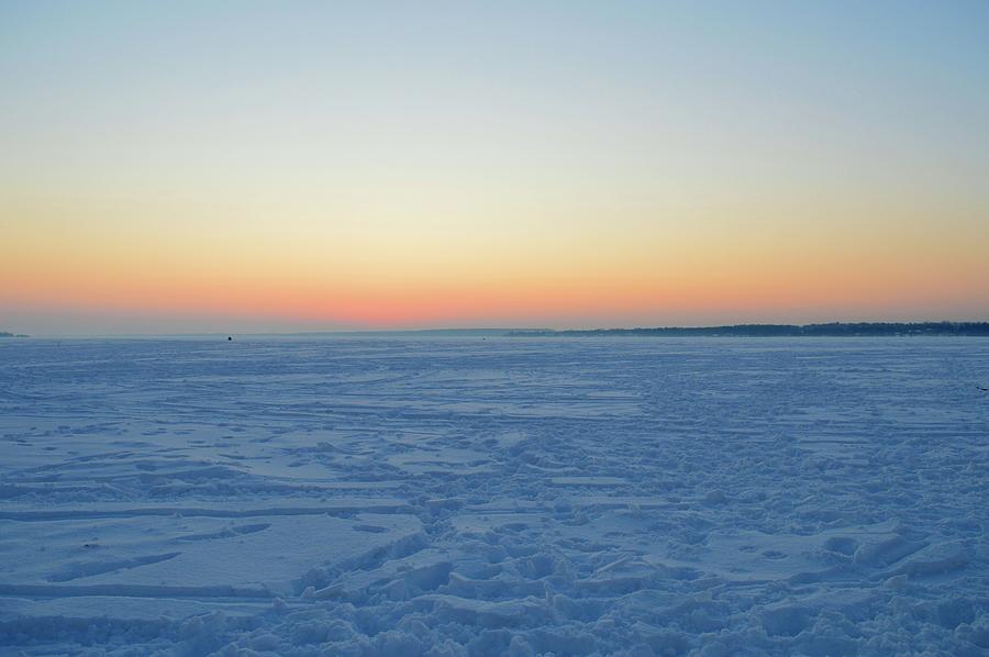 Snow And Ice Covered Lake At Sunrise  Photograph by Lyle Crump