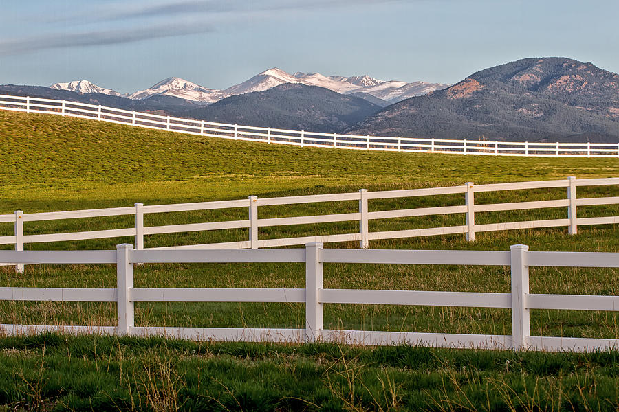 Snow Capped Mountain Peaks and white split rail Fencing Photograph by Ronda Kimbrow