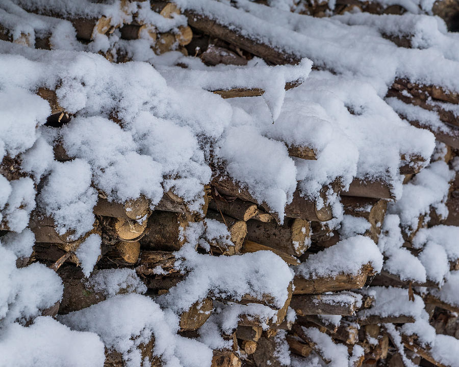 Snow Covered Firewood Photograph by Chris Bordeleau