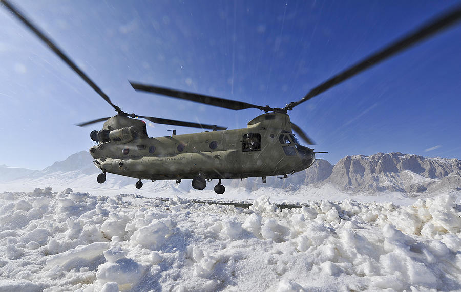 Snow Flies Up As A U.s. Army Ch-47 Photograph by Stocktrek Images