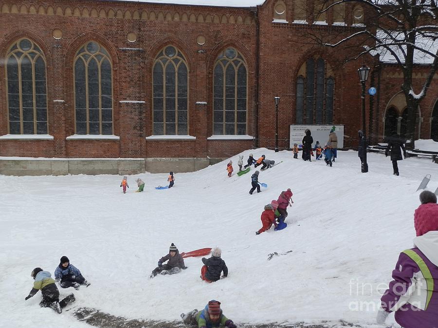 Snow play in Riga Photograph by Margaret Brooks