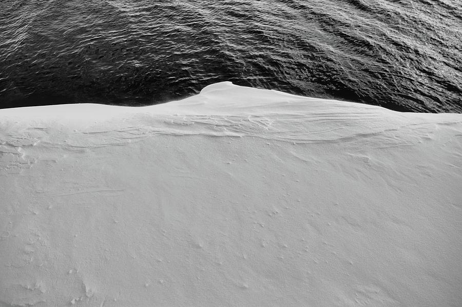 Snowbank Over Water BW  Photograph by Lyle Crump