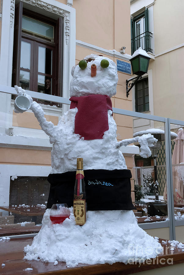 Snowman on a table Photograph by George Atsametakis
