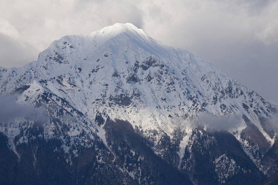 Snowy Alpine peak Photograph by Ian Middleton