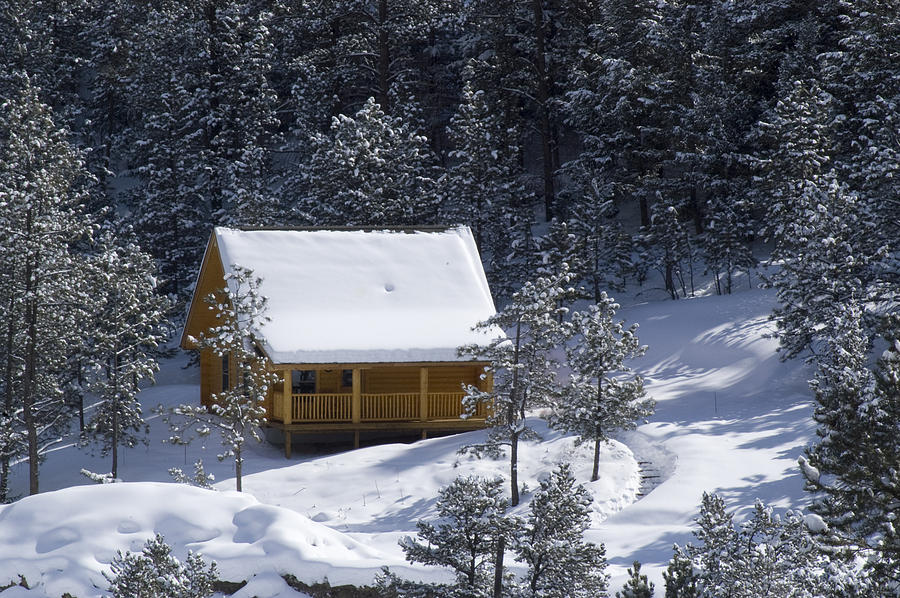 log cabin in the snowy mountains