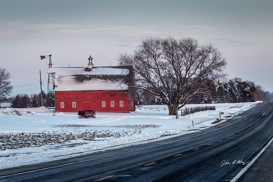 Snowy Red Barn And Sunset Along Highway Photograph By Jeffrey Henry