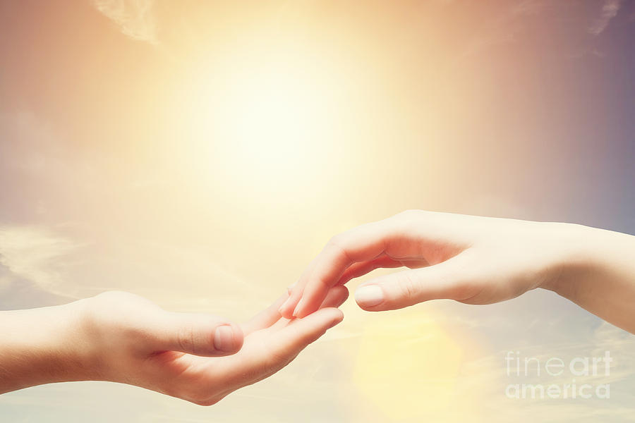 Soft and gentle touch of man and woman against sunny sky with flare in vintage mood Photograph by Michal Bednarek