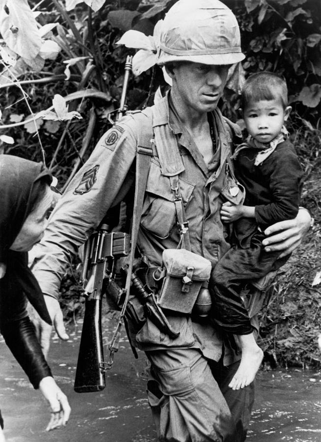Soldier Carrying Boy Photograph by Underwood Archives