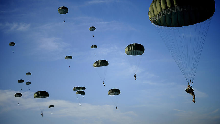 Soldiers Descend Under A Parachute Photograph by Stocktrek Images