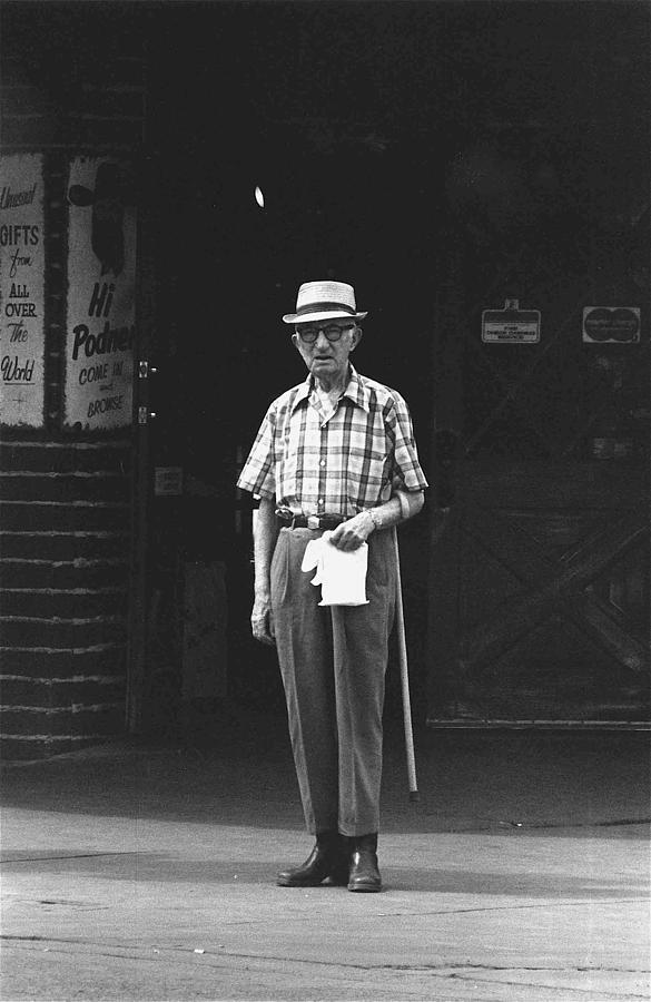 Solitary man with cane and paper bag Las Vegas Nevada 1977 Photograph by David Lee Guss