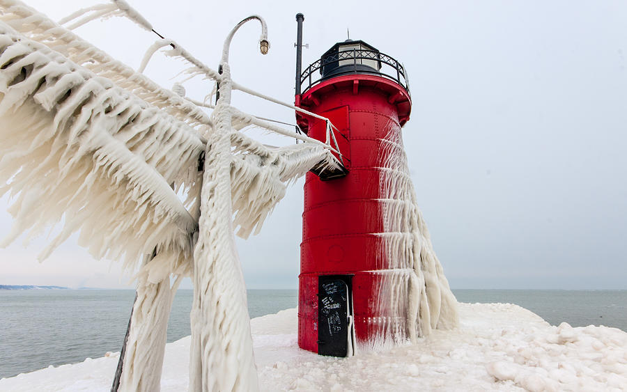 South Haven Lighthouse frozen catwalk Photograph by Joe Holley