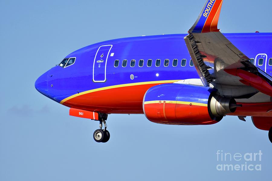 Southwest Airlines airplane in flight Photograph by JL Images - Fine ...