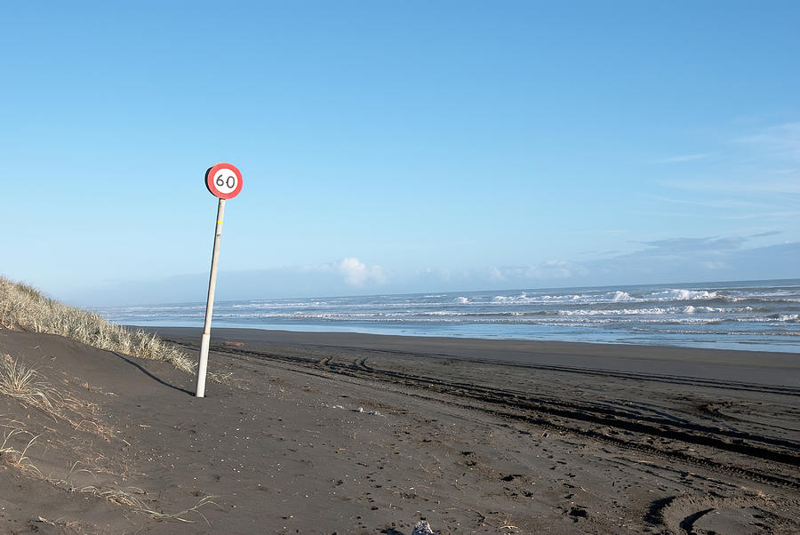 Sign Photograph - Speed sign on the ocean  beach by Yurix Sardinelly