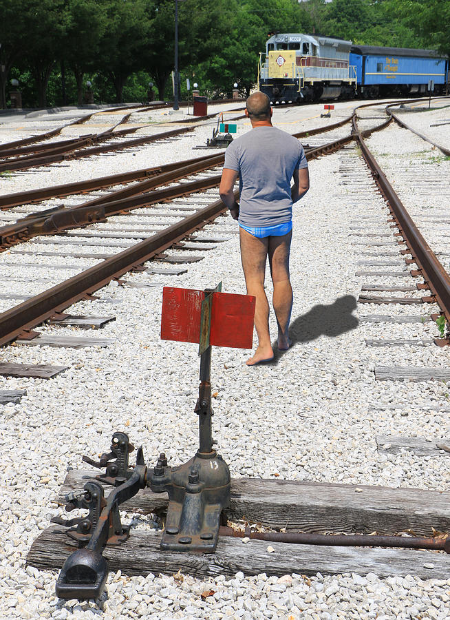 Speedo Man in Rail Yard Photograph by Christopher McKenzie