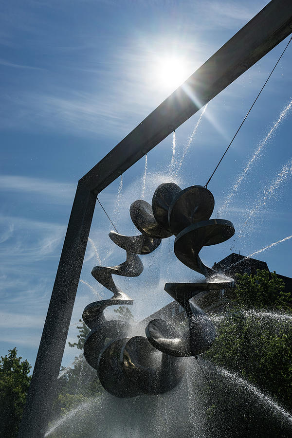 Spiral Sculpture Fountain with a Sun Burst Photograph by Georgia Mizuleva