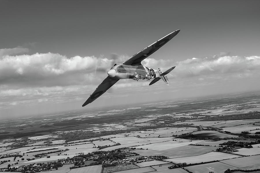 Spitfire TR 9 on a roll BW version Photograph by Gary Eason
