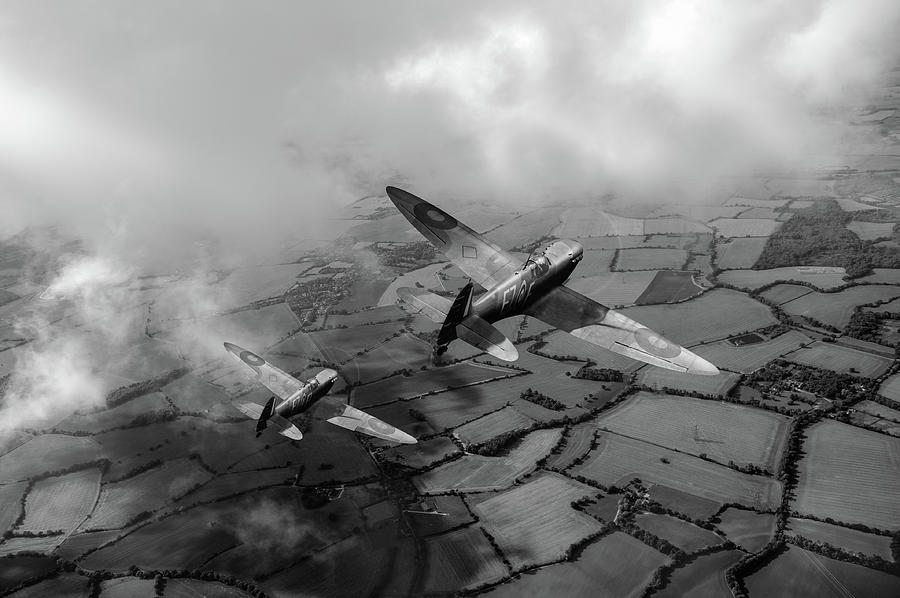 Spitfires among low clouds BW version Photograph by Gary Eason