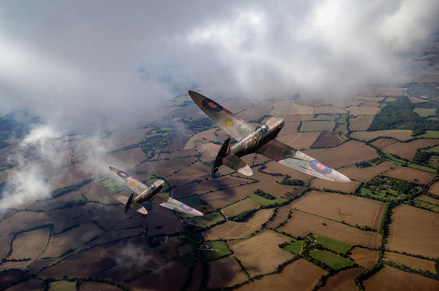 Spitfires among low clouds Photograph by Gary Eason