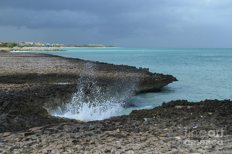 Splashing Waves Under Dark Skies in Coastal Aruba Photograph by DejaVu Designs