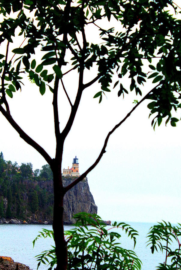 Split Rock Lighthouse through the trees Photograph by John Olson