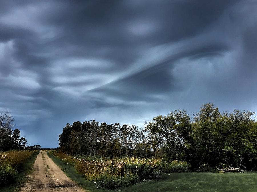 Spooky clouds Photograph by David Matthews