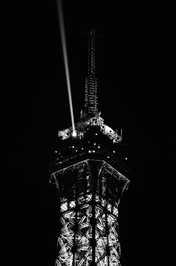 Spotlight Extending from Top of Illuminated Night View of Eiffel Tower Paris France Black and White Photograph by Shawn OBrien