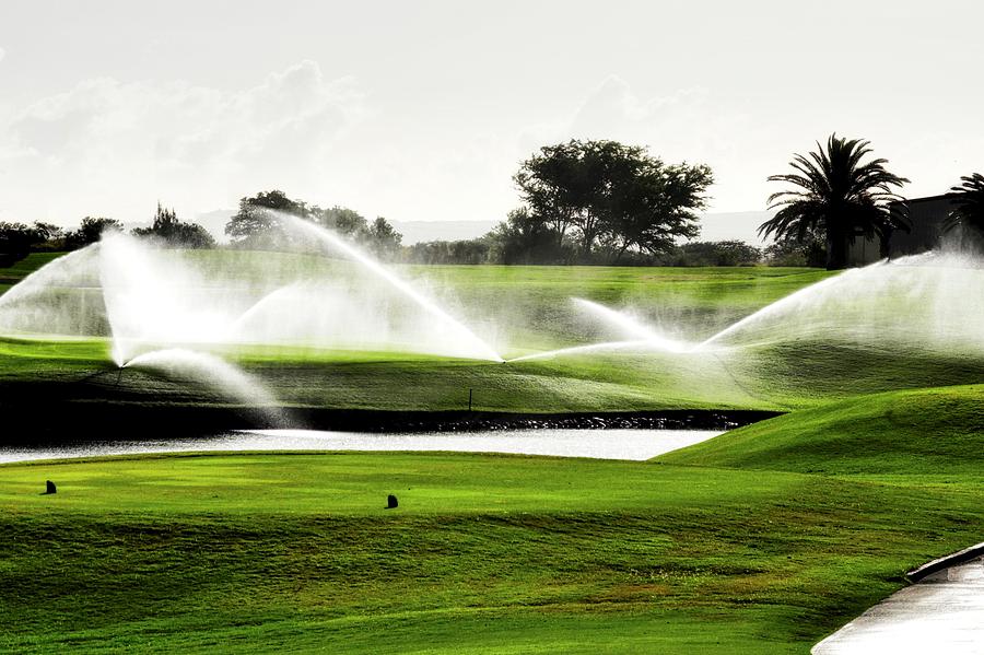 Sprinkler Sprays on a Golf Course Photograph by Kirsten Giving