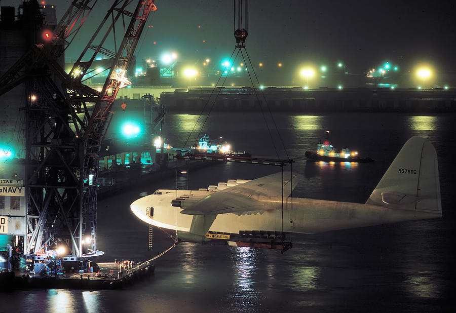 Spruce Goose Hanging From Crane February 10 1982 Photograph by Brian Lockett