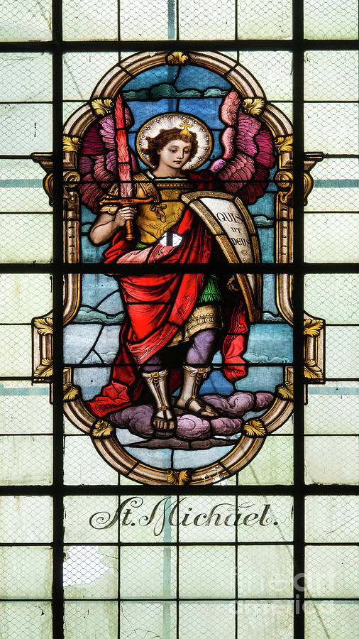 St Michael - stained glass window in the church of the Visitation Photograph by Michal Boubin
