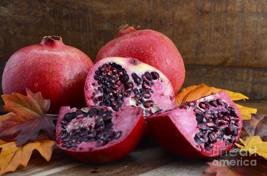 Fall Photograph - Stack of fresh pomegranates  by Milleflore Images