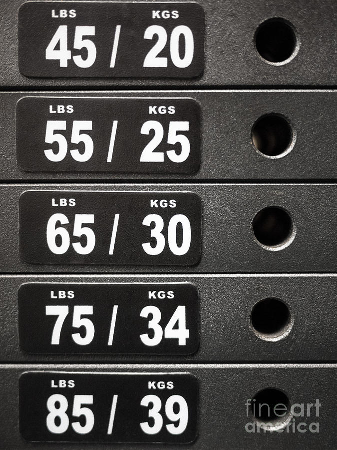 Kgs Photograph - Stack of Weight Plates  on Gym Equipment by Paul Velgos