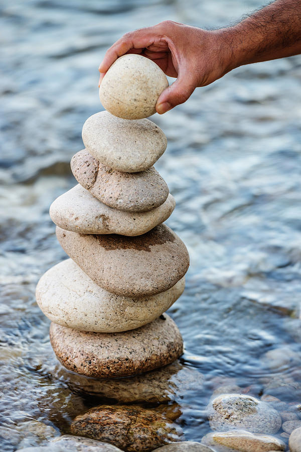 Stacking the pebbles Photograph by Vishwanath Bhat