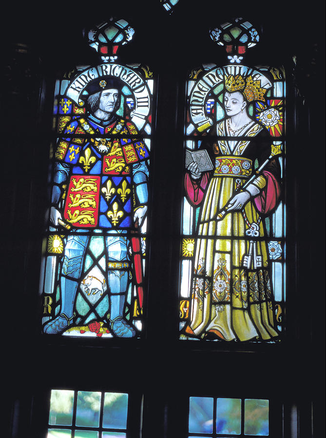 Stained glass window with Sleeping Beauty's parents. King and