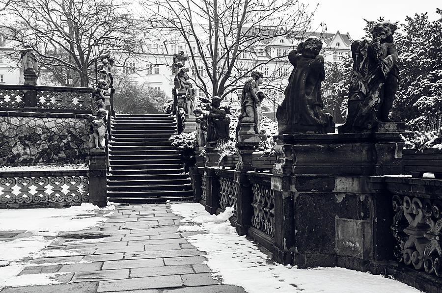 Staircase and Sculptures of Cherubs in Loreta Complex 1. Snowy walk in Prague Photograph by Jenny Rainbow