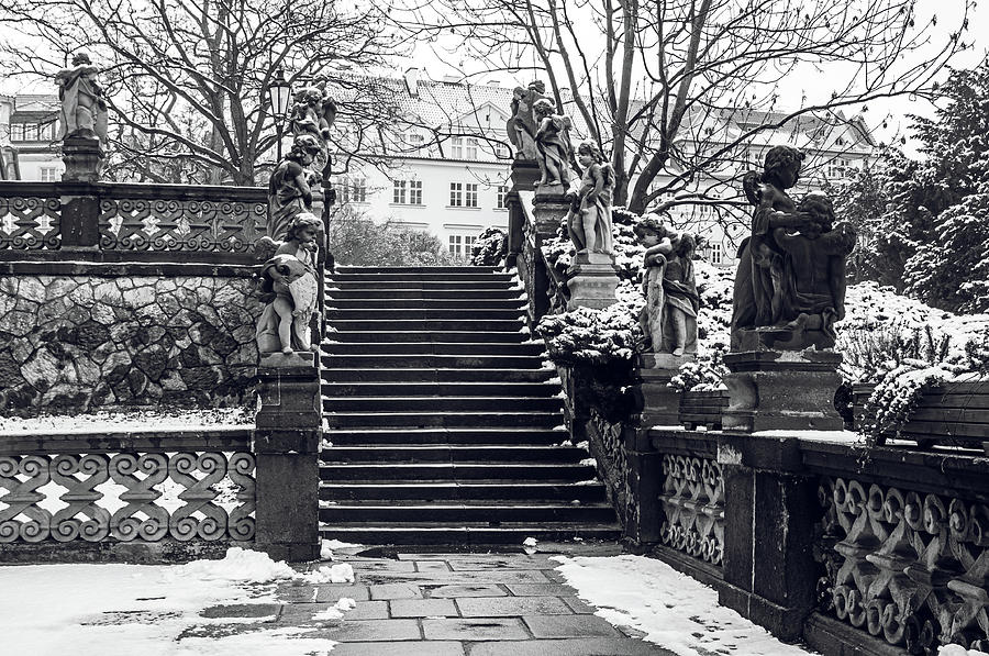 Staircase and Sculptures of Cherubs in Loreta Complex Black and White Photograph by Jenny Rainbow