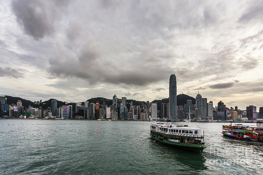 Star Ferry between Kowloon and Hong Kong island during sunset Photograph by Didier Marti