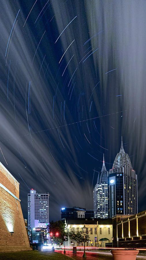 Star Trails and City Lights Photograph by Brad Boland