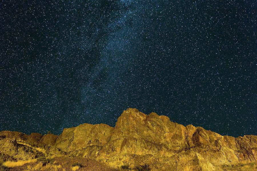 Planet Photograph - Starry Night Sky over Rocky Landscape by David Gn