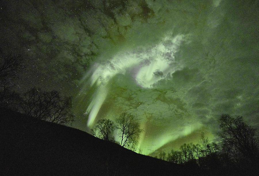 Stars, Clouds and Northern Lights Photograph by Pekka Sammallahti