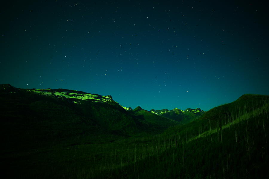 Stars mountains and a little light Photograph by Jeff Swan