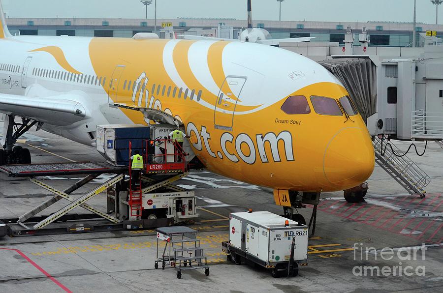 Car Photograph - Stationary Scoot airline airplane serviced on Changi airport tarmac Singapore by Imran Ahmed