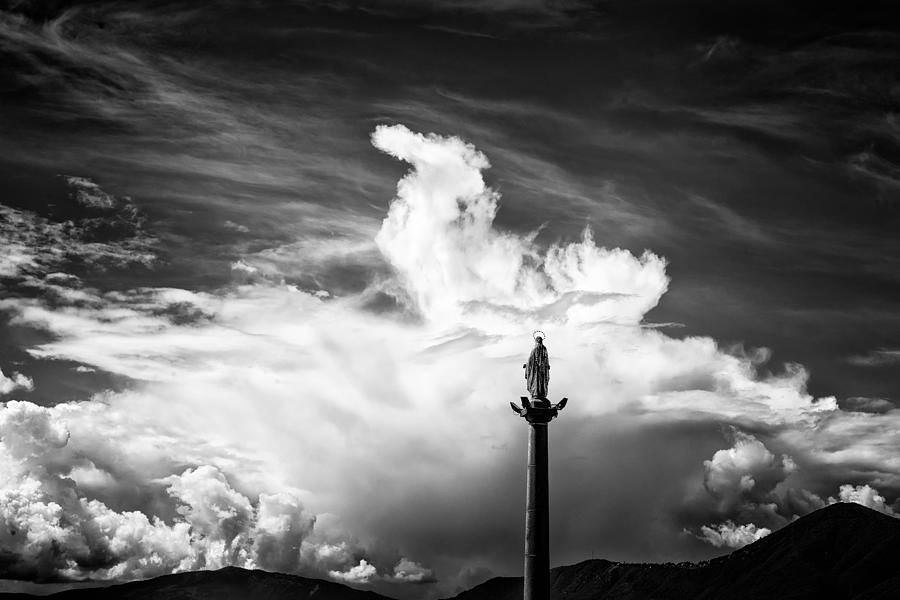 Statue and dark sky with dramatic clouds Photograph by Matthias Hauser