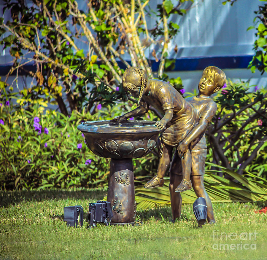 Statue of children playing Photograph by Claudia M Photography